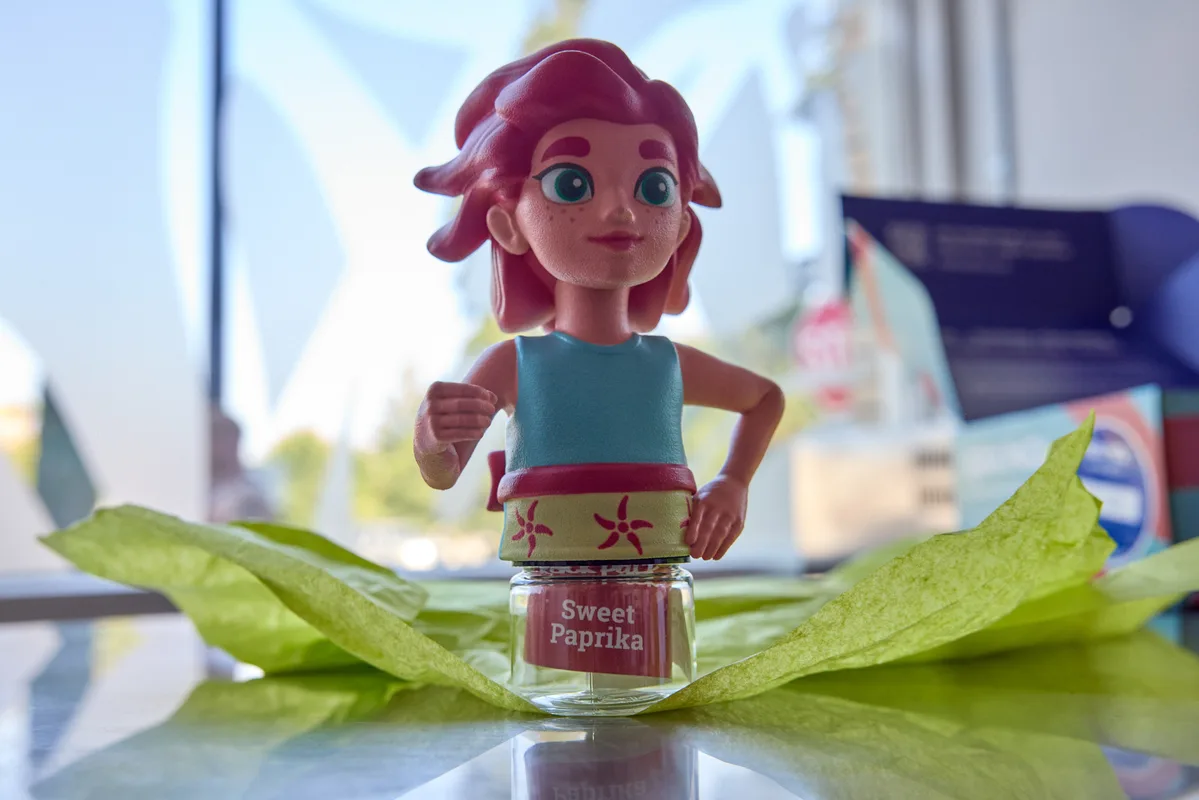 The Paprika figurine standing on her Sweet Paprika spice jar