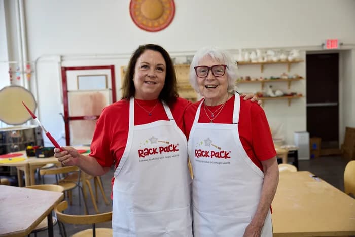Liz Kupillas with her mother, both wearing Rack Pack aprons